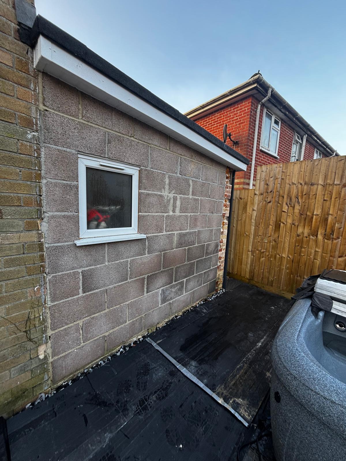 Rough concrete block wall before professional plastering